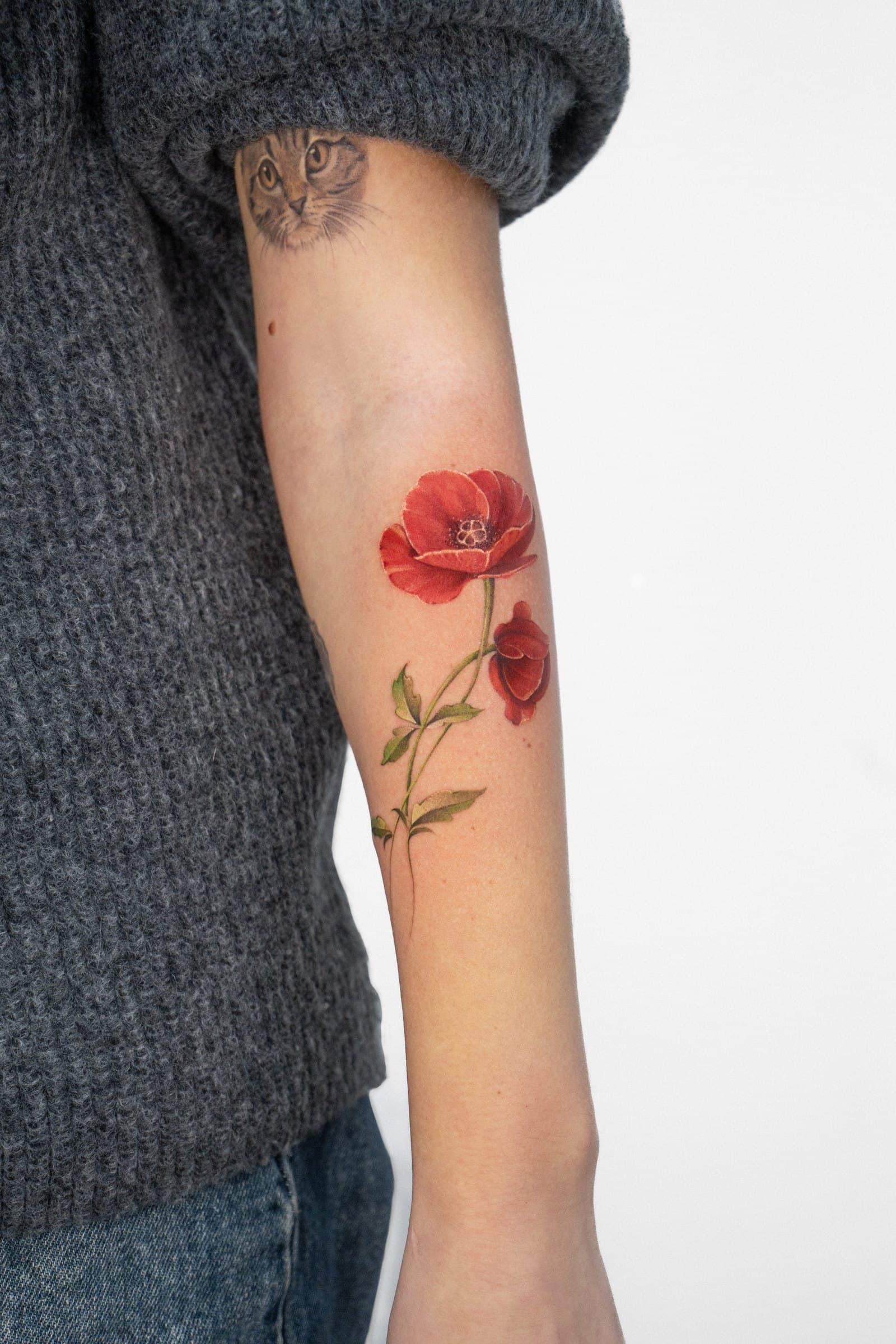 Red poppies, tattoo by Nicolly