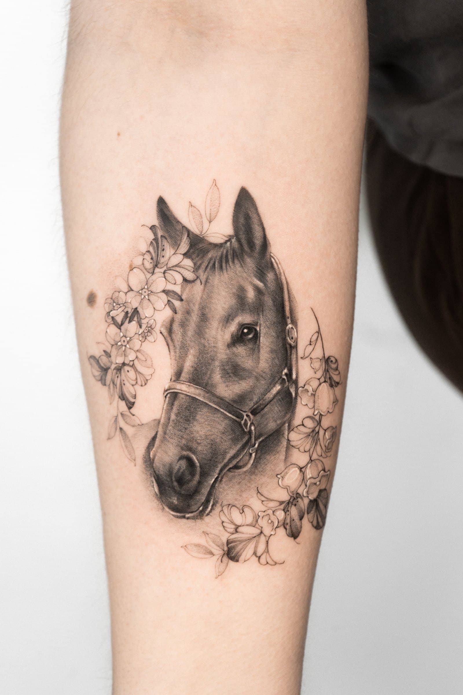 Horse with blossom, tattoo by Nicolly