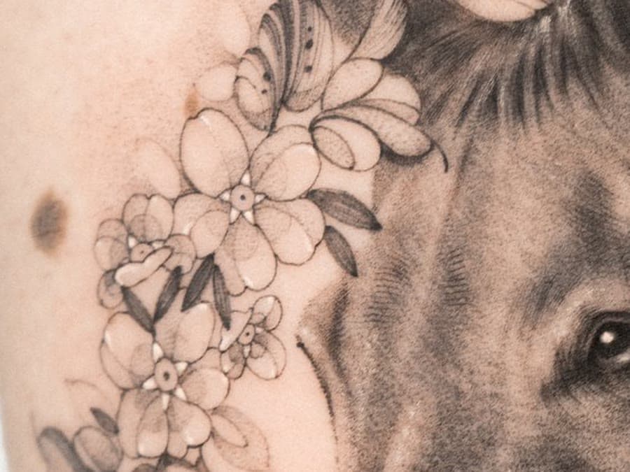 The forget-me-nots tattooed beside Boo's ear